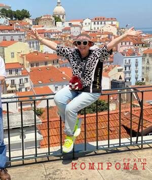 Lela Chania on vacation in Portugal.  She's wearing Dolce & Gabbana designer sneakers.  Lowest price for a new pair in sale listings - $350