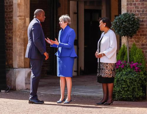 From left to right: Roosevelt Skerritt, Theresa May and Patricia Scotland