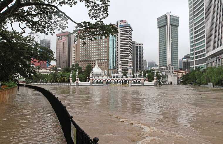 Heavy rain in Malaysia's capital has led to flooded streets and traffic congestion.